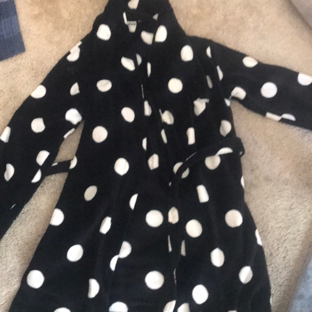 VSPink fuzzy black and white robe never worn but does have a flaw in photos